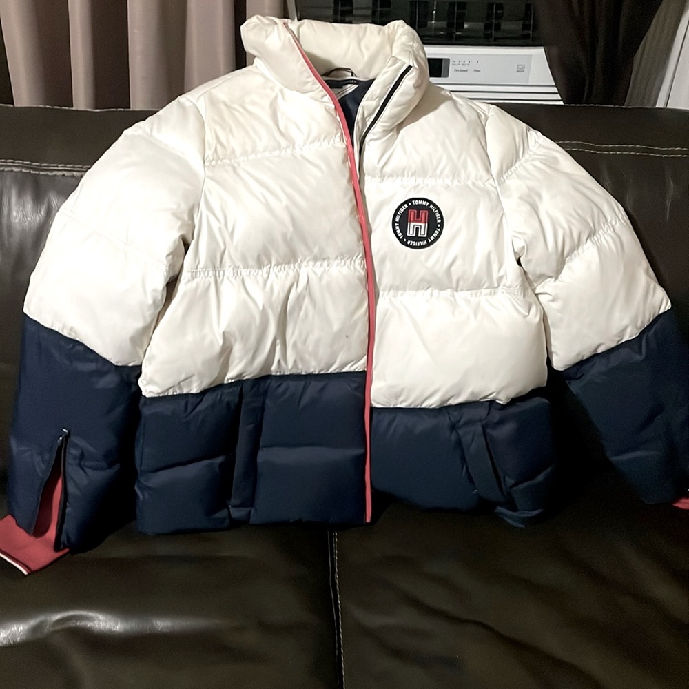 Great conditionTommy Hilfiger Coat, with arm zip and thumb hangout